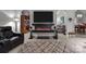 Cozy living room with a fireplace, wall-mounted TV, and inviting furniture at 1525 Valhalla Dr, Denver, NC 28037