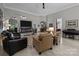 Spacious living room featuring a fireplace, modern lighting, and neutral colors at 1525 Valhalla Dr, Denver, NC 28037