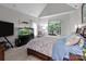 Main bedroom featuring a tray ceiling, an aquarium, a king bed, and natural light from the window at 1525 Valhalla Dr, Denver, NC 28037