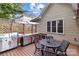 Outdoor kitchen with built-in grill, sink, prep area, and a dining table for entertainment at 1525 Valhalla Dr, Denver, NC 28037