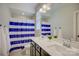 Bathroom featuring a double vanity, a shower and modern fixtures, ensuring convenience for all at 15344 Cimarron Hills Ln, Charlotte, NC 28278