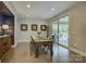 Dining room with hardwood floors and sliding glass doors leading to the outdoor area at 15344 Cimarron Hills Ln, Charlotte, NC 28278