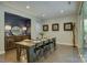 Dining area with hardwood floors, modern decor, and ample natural light at 15344 Cimarron Hills Ln, Charlotte, NC 28278
