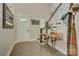 Bright and airy foyer featuring hardwood floors, a staircase, and unique decorative elements at 15344 Cimarron Hills Ln, Charlotte, NC 28278