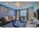 Fun game room featuring custom lighting, comfortable seating, and entertainment options at 15344 Cimarron Hills Ln, Charlotte, NC 28278