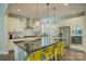 Gourmet kitchen featuring a large island, stainless steel appliances, and elegant pendant lighting at 15344 Cimarron Hills Ln, Charlotte, NC 28278