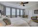 Bright main bedroom featuring a tray ceiling and large windows with lots of natural light at 15344 Cimarron Hills Ln, Charlotte, NC 28278