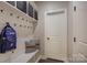 Mudroom with built-in storage, hooks, bench, and easy access to other areas of the home at 15344 Cimarron Hills Ln, Charlotte, NC 28278