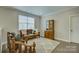 Cozy sitting room with hardwood floors, neutral paint, and lots of natural light at 15344 Cimarron Hills Ln, Charlotte, NC 28278