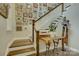 Stylish staircase featuring hardwood steps and a decorative gallery wall at 15344 Cimarron Hills Ln, Charlotte, NC 28278