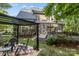 Beautiful backyard view featuring a multi-level deck, pergola, and lush greenery, great for outdoor living at 154 Hunters Hill Dr, Statesville, NC 28677