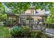 Beautiful backyard deck with pergola, outdoor seating, and lush landscaping for relaxing outdoor living at 154 Hunters Hill Dr, Statesville, NC 28677