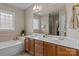 Bright bathroom features double vanity, soaking tub, and large mirror at 154 Hunters Hill Dr, Statesville, NC 28677