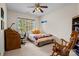 Comfortable bedroom featuring a desk, book shelves, and chair at 154 Hunters Hill Dr, Statesville, NC 28677