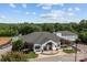 Aerial view of a large white clubhouse with a well-manicured lawn, inviting and sophisticated at 154 Hunters Hill Dr, Statesville, NC 28677