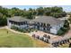 A stunning clubhouse features golf cart parking, outdoor dining, and an attractive two-story design perfect for community gatherings at 154 Hunters Hill Dr, Statesville, NC 28677