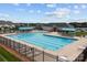 The community pool provides ample swimming space with clear lanes, a fenced perimeter, and nearby amenities for relaxation at 154 Hunters Hill Dr, Statesville, NC 28677