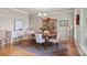 Elegant dining room featuring hardwood floors, a chandelier, and a classic china cabinet at 154 Hunters Hill Dr, Statesville, NC 28677