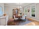 Cozy dining room features hardwood floors, chandelier, and windows providing lots of natural light at 154 Hunters Hill Dr, Statesville, NC 28677