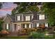 Two-story home with manicured landscaping, a red front door, and inviting evening ambiance at 154 Hunters Hill Dr, Statesville, NC 28677