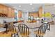 The kitchen has wood cabinets and countertops, and three chairs for seating at 154 Hunters Hill Dr, Statesville, NC 28677