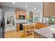 Modern kitchen with a central island and views of the living room fireplace at 154 Hunters Hill Dr, Statesville, NC 28677