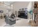 Open-concept living room features a large TV, comfortable seating, and views to a second-floor landing at 154 Hunters Hill Dr, Statesville, NC 28677