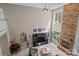 Expansive living room featuring a soaring fireplace and windows at 154 Hunters Hill Dr, Statesville, NC 28677