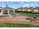 An inviting outdoor area offers a fire pit, grilling station, picnic tables, and playground, surrounded by well-maintained lawns at 154 Hunters Hill Dr, Statesville, NC 28677