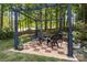 Outdoor seating area featuring a stylish pergola, perfect for relaxing and entertaining at 154 Hunters Hill Dr, Statesville, NC 28677