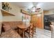 Cozy dining area with built-in seating, wood table, and modern appliances at 199 Ashmont Dr, Kannapolis, NC 28081