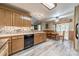 Well-lit kitchen with wood cabinets, modern appliances, and a dining area with sliding door access at 199 Ashmont Dr, Kannapolis, NC 28081