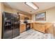 Efficient kitchen featuring modern appliances, wood cabinets, and sleek flooring for easy maintenance at 199 Ashmont Dr, Kannapolis, NC 28081
