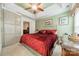 Serene main bedroom with tray ceilings, a ceiling fan, and a large picture window at 199 Ashmont Dr, Kannapolis, NC 28081