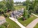 Aerial view of a stunning home with a well-manicured lawn and mature trees at 208 South Shore Dr, Belmont, NC 28012