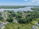 Aerial shot of the neighborhood with mature trees near the lake showing the homes in the community at 208 South Shore Dr, Belmont, NC 28012