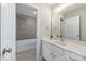 A well-lit bathroom features neutral tile, a tub, and modern fixtures at 208 South Shore Dr, Belmont, NC 28012