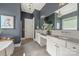 Elegant bathroom with dual vanities, mosaic tile backsplash, and decorative lighting fixtures at 208 South Shore Dr, Belmont, NC 28012