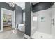 Stylish bathroom featuring a soaking tub, glass-enclosed shower, and modern fixtures at 208 South Shore Dr, Belmont, NC 28012