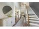 Grand foyer with a staircase, a decorative mirror, and stylish hardwood flooring at 208 South Shore Dr, Belmont, NC 28012