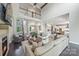 Expansive living room with high ceilings, a fireplace, and seamless flow to the dining area at 208 South Shore Dr, Belmont, NC 28012