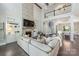 Spacious living room features a stone fireplace, built-in shelving, and an open floor plan at 208 South Shore Dr, Belmont, NC 28012