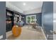 Study room featuring custom built-ins, neutral walls, natural light, and a comfortable reading space at 208 South Shore Dr, Belmont, NC 28012