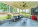 Relaxing screened porch with comfortable seating, ceiling fan, and views of the landscaped backyard at 208 South Shore Dr, Belmont, NC 28012