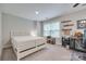 Neutral bedroom with large window, desk, and white bed at 268 Hillsborough Ln, Rock Hill, SC 29732