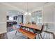 Dining room with large wooden table, modern chairs, and view into the kitchen at 268 Hillsborough Ln, Rock Hill, SC 29732