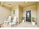 Inviting front porch features two white rocking chairs and a beautifully decorated front door at 268 Hillsborough Ln, Rock Hill, SC 29732