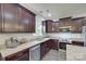 Well-appointed kitchen featuring stainless steel appliances, dark wood cabinets, and granite countertops at 268 Hillsborough Ln, Rock Hill, SC 29732