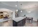 Bright open kitchen with granite island, pendant lights, and stainless steel appliances at 268 Hillsborough Ln, Rock Hill, SC 29732
