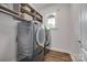 Modern laundry room with front loading washer and dryer and built-in shelves at 268 Hillsborough Ln, Rock Hill, SC 29732